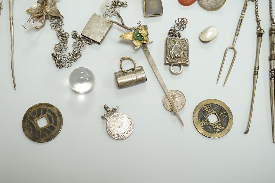 A collection of Chinese Straits white metal hooks, a chatelaine, South East Asian coinage and other items, etc.